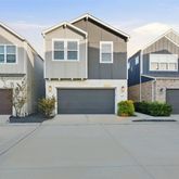 a front view of a house with yard