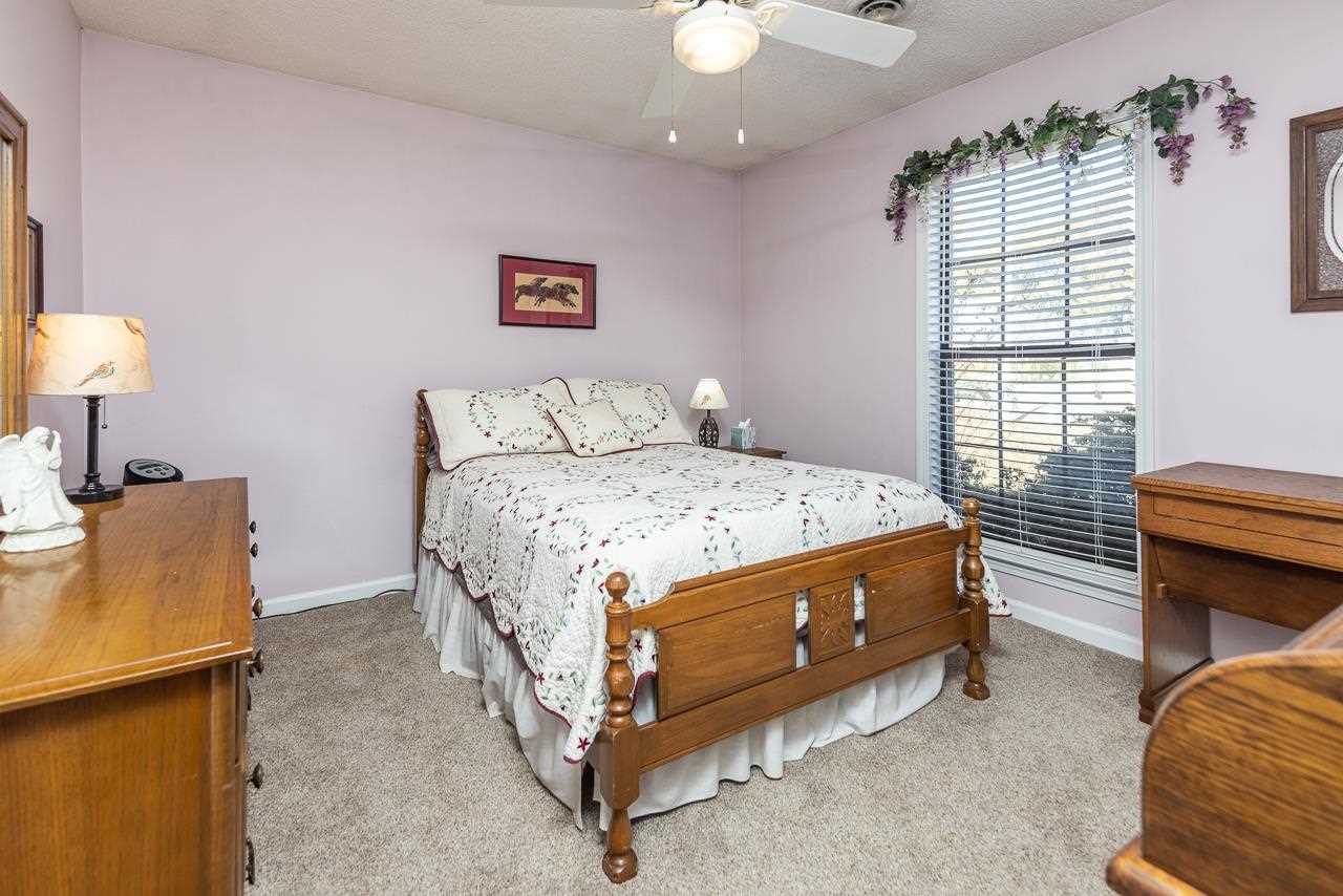 297 East White Road Collierville, TN 38017 - Photo 13 of 20 a bed room with a bed and a chair