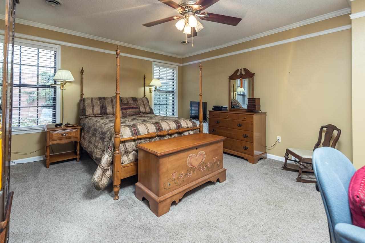 297 East White Road Collierville, TN 38017 - Photo 15 of 20 a bedroom with a bed and a table