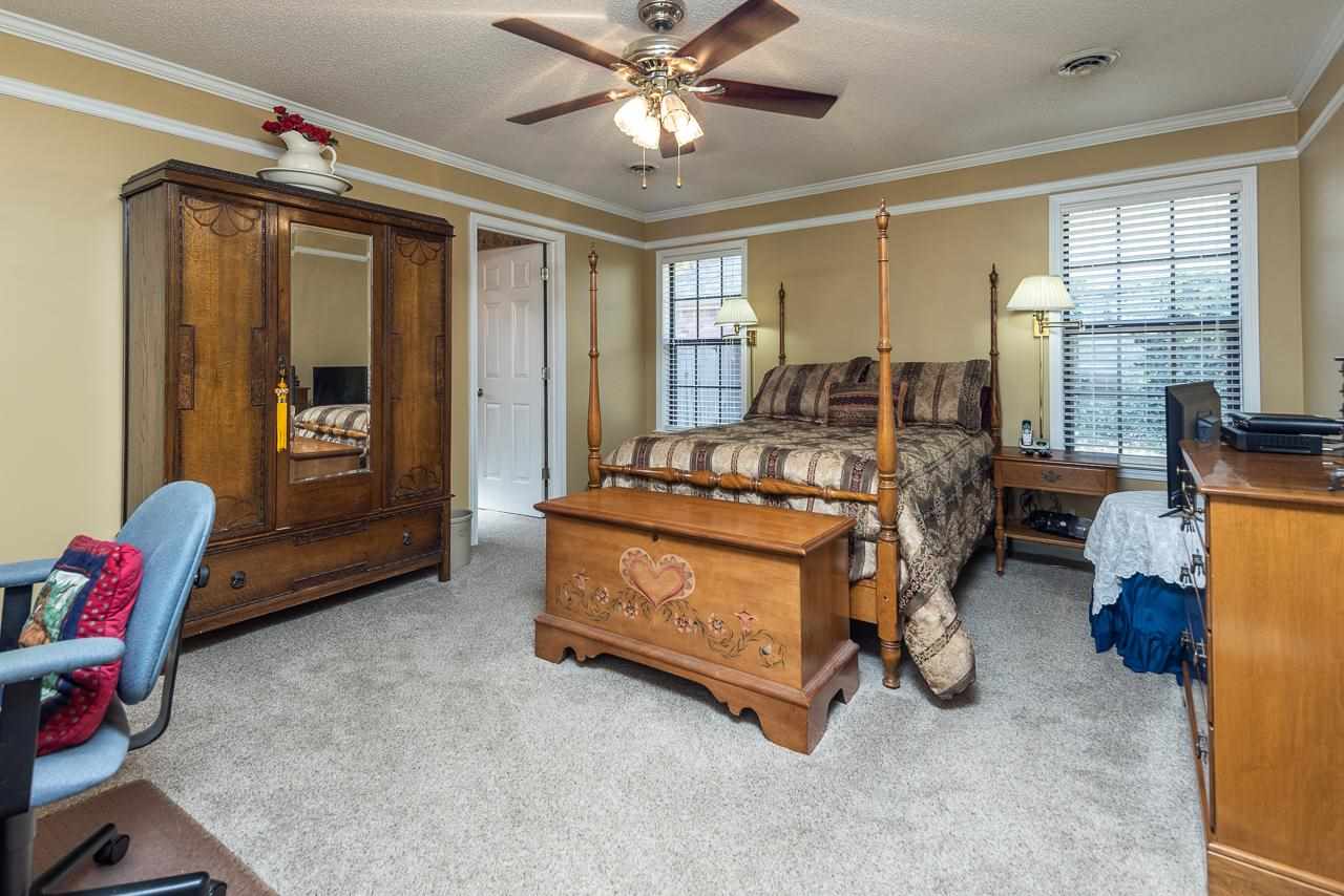 297 East White Road Collierville, TN 38017 - Photo 16 of 20 a bed room with furniture and a window
