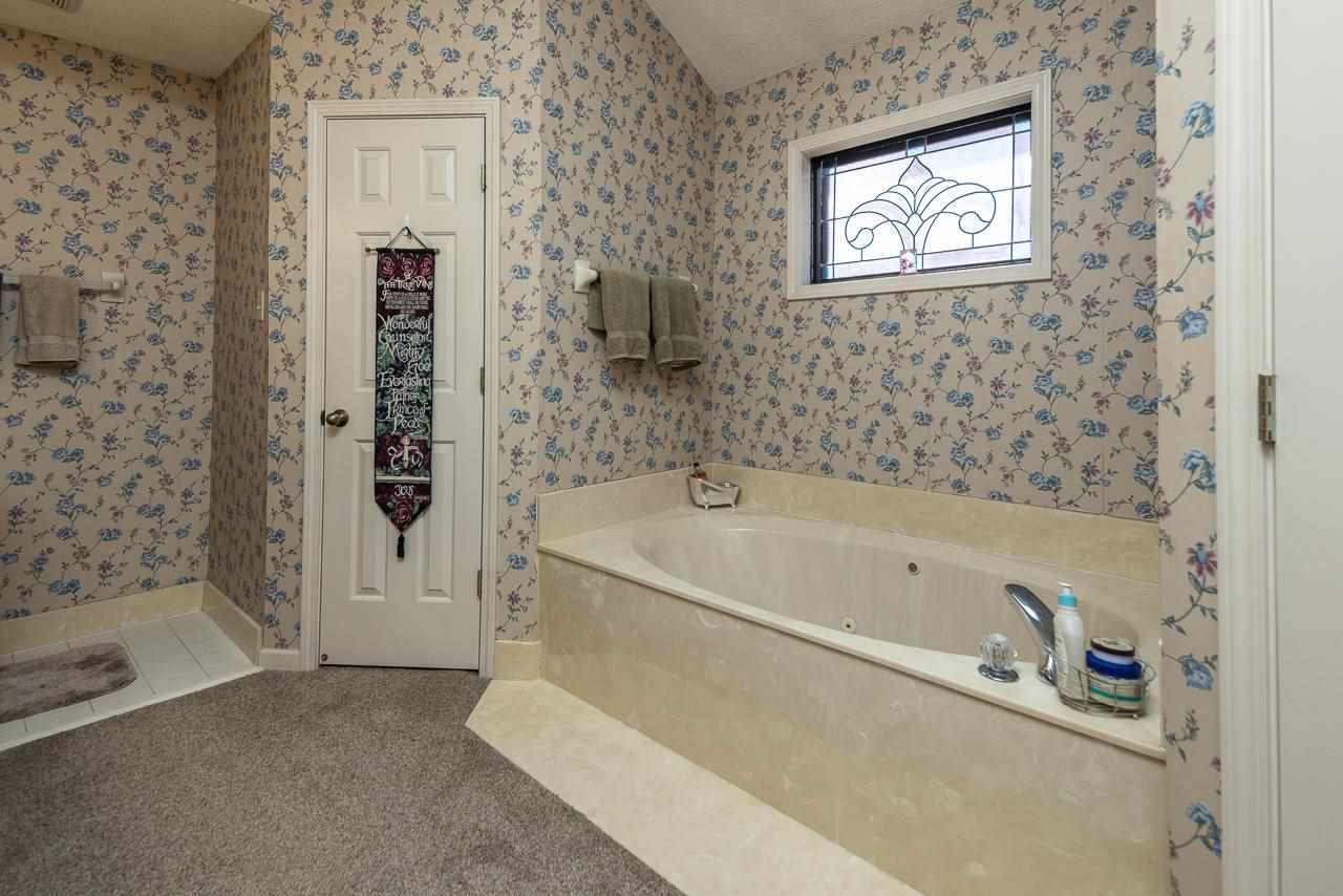 297 East White Road Collierville, TN 38017 - Photo 17 of 20 a bathroom with a bathtub and shower