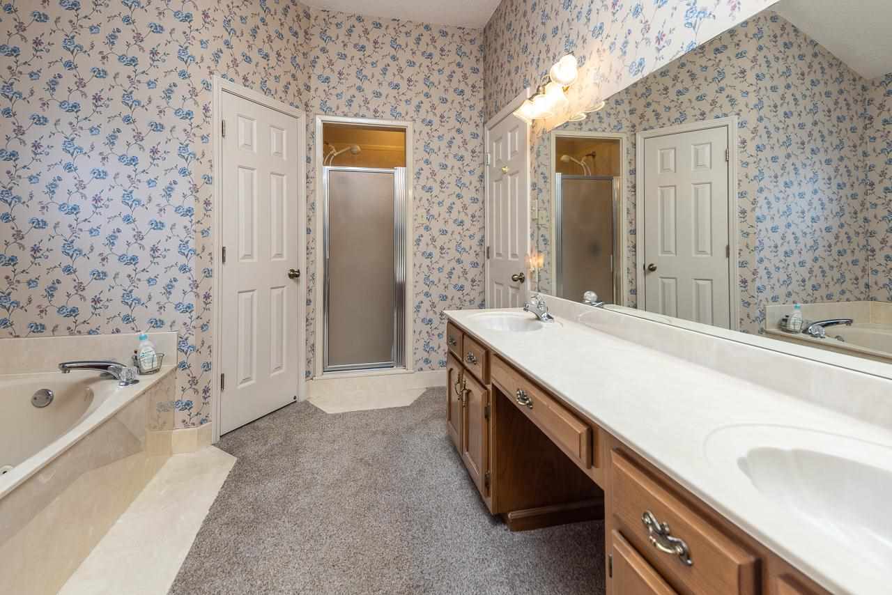 297 East White Road Collierville, TN 38017 - Photo 18 of 20 a spacious bathroom with a tub sink and mirror