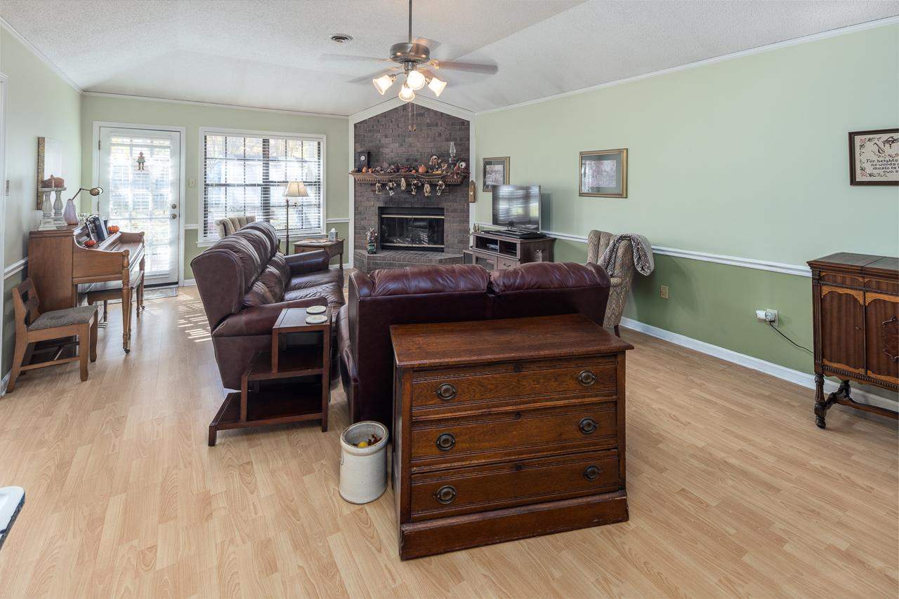 297 East White Road Collierville, TN 38017 - Photo 3 of 20 a living room with furniture and a flat screen tv