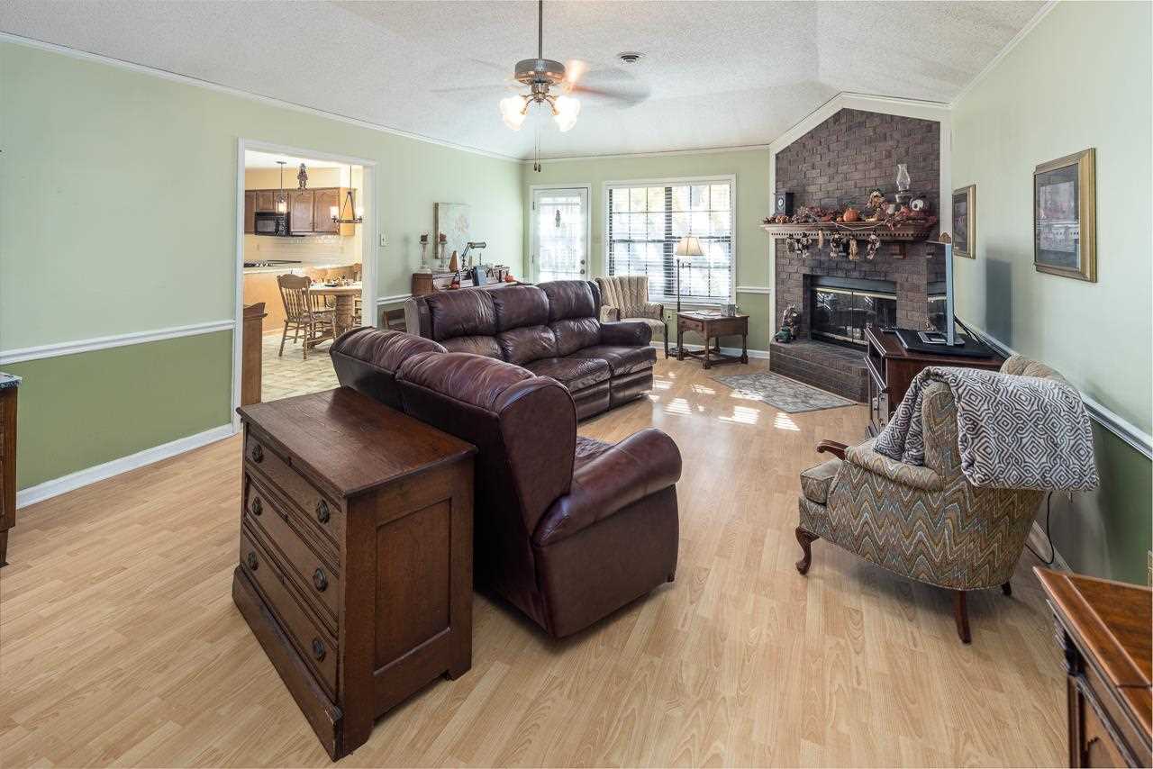 297 East White Road Collierville, TN 38017 - Photo 4 of 20 a living room with furniture and a flat screen tv