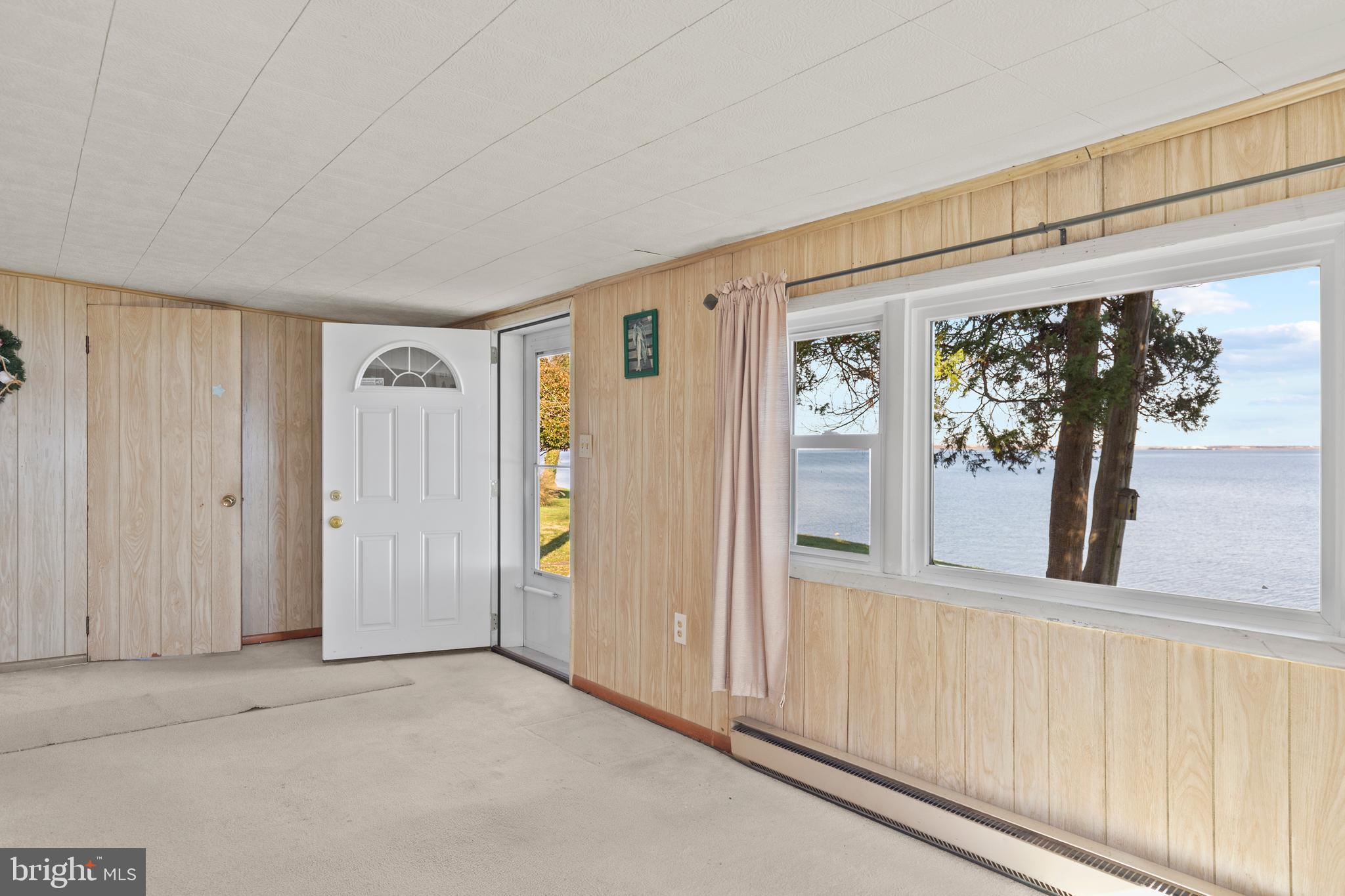 8569 Bay Road Pasadena, MD 21122 - Photo 7 of 41 Waterside entrance into Living Room