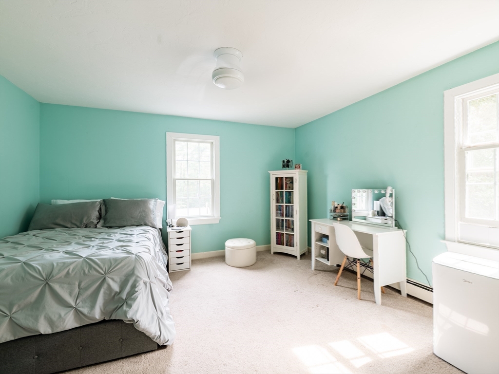 17 Gardner Road Duxbury, MA 02332 - Photo 38 of 42 a bed room with a bed and a chair