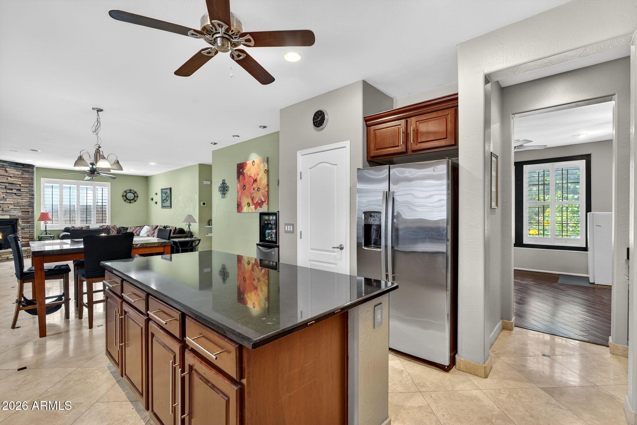1729 South Reseda Street Gilbert, AZ 85295 - Photo 16 of 52 a kitchen with stainless steel appliances granite countertop a refrigerator a stove and a sink