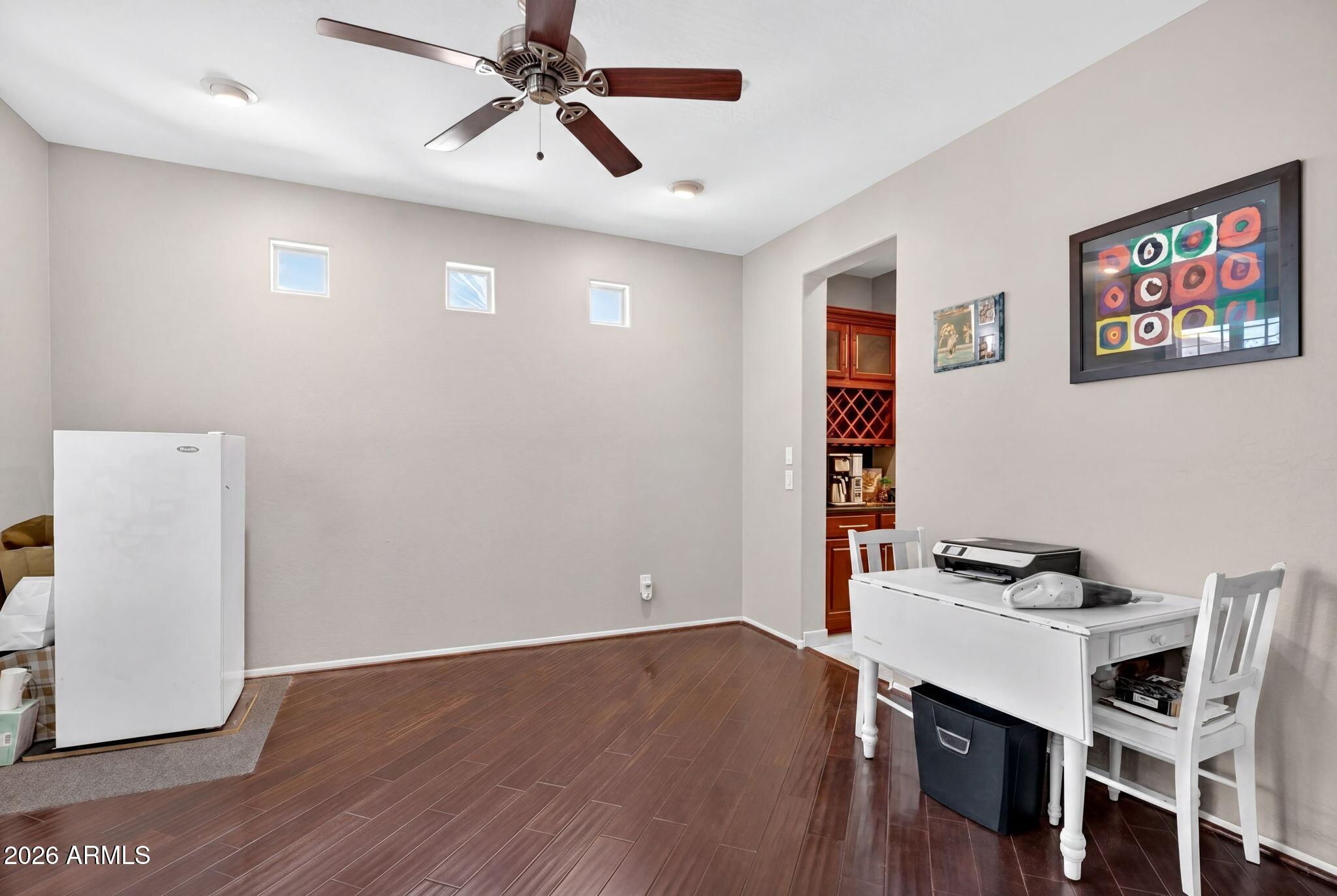 1729 South Reseda Street Gilbert, AZ 85295 - Photo 21 of 52 a view of a workspace with furniture and wooden floor
