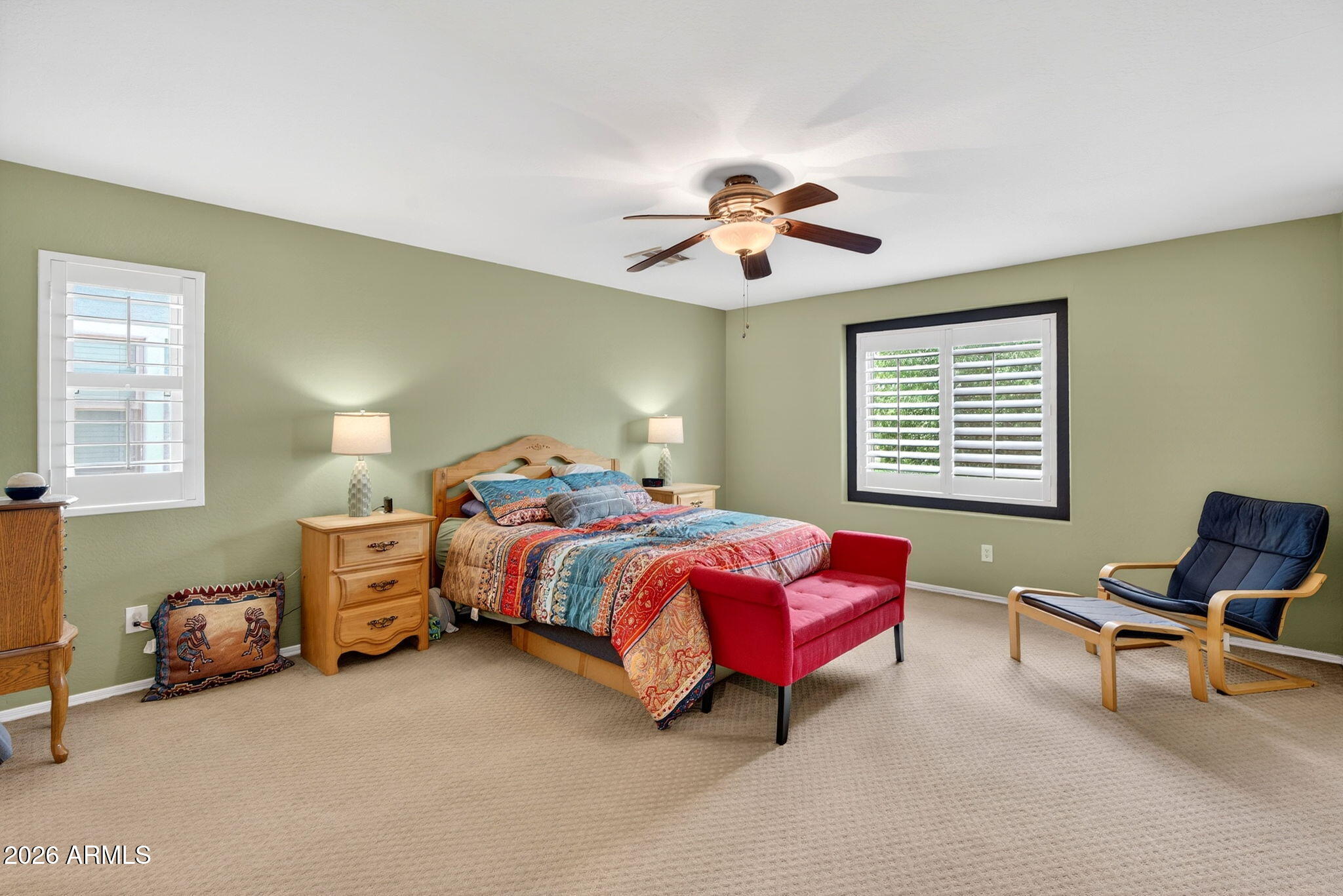 1729 South Reseda Street Gilbert, AZ 85295 - Photo 26 of 52 a spacious bedroom with a bed and a chandelier