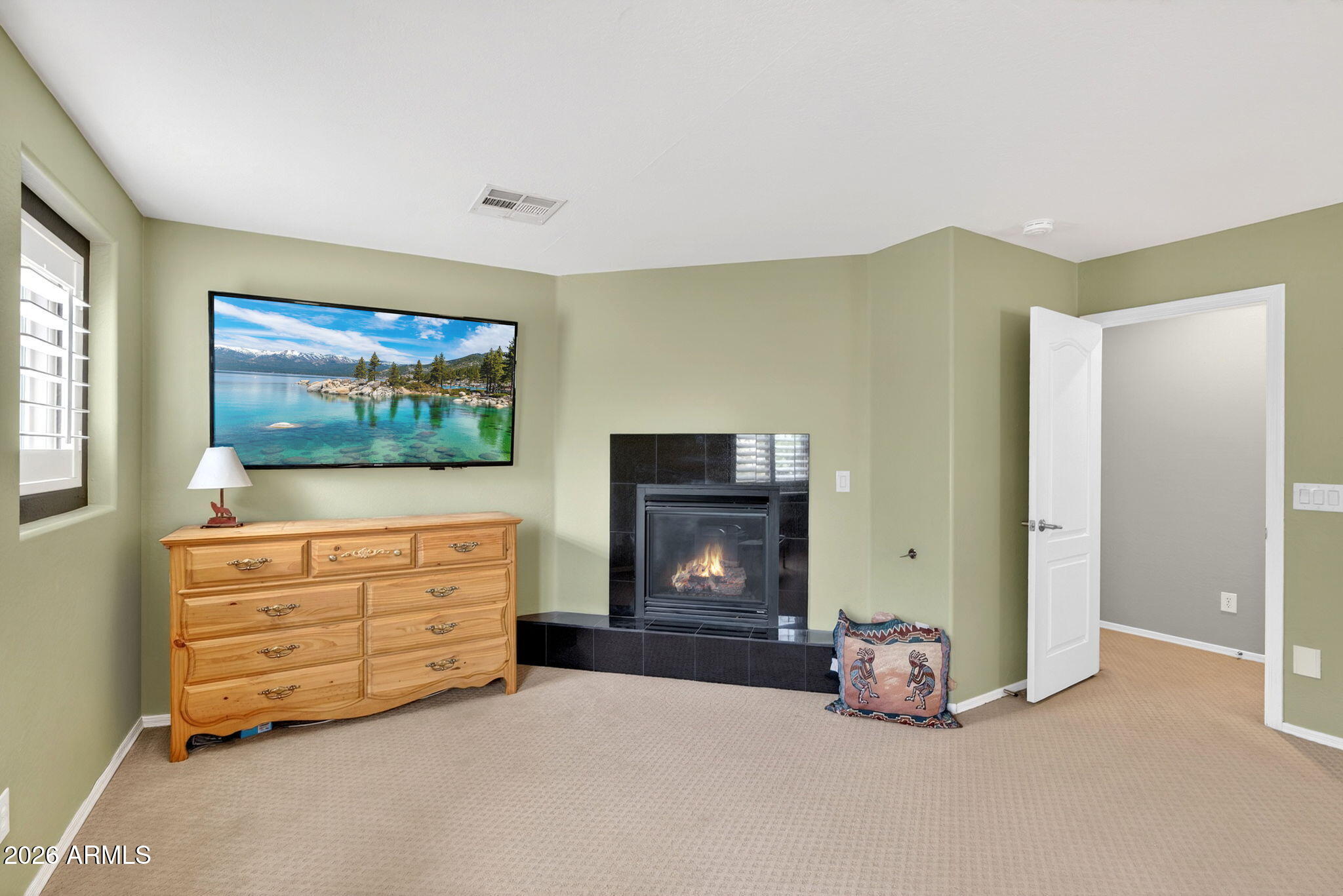 1729 South Reseda Street Gilbert, AZ 85295 - Photo 31 of 52 a room with furniture and a flat screen tv