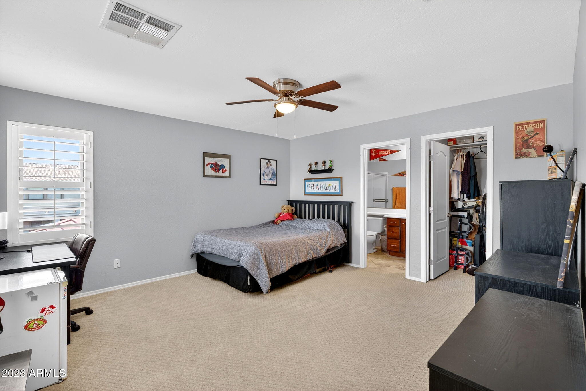 1729 South Reseda Street Gilbert, AZ 85295 - Photo 39 of 52 a bedroom with a bed and a chandelier
