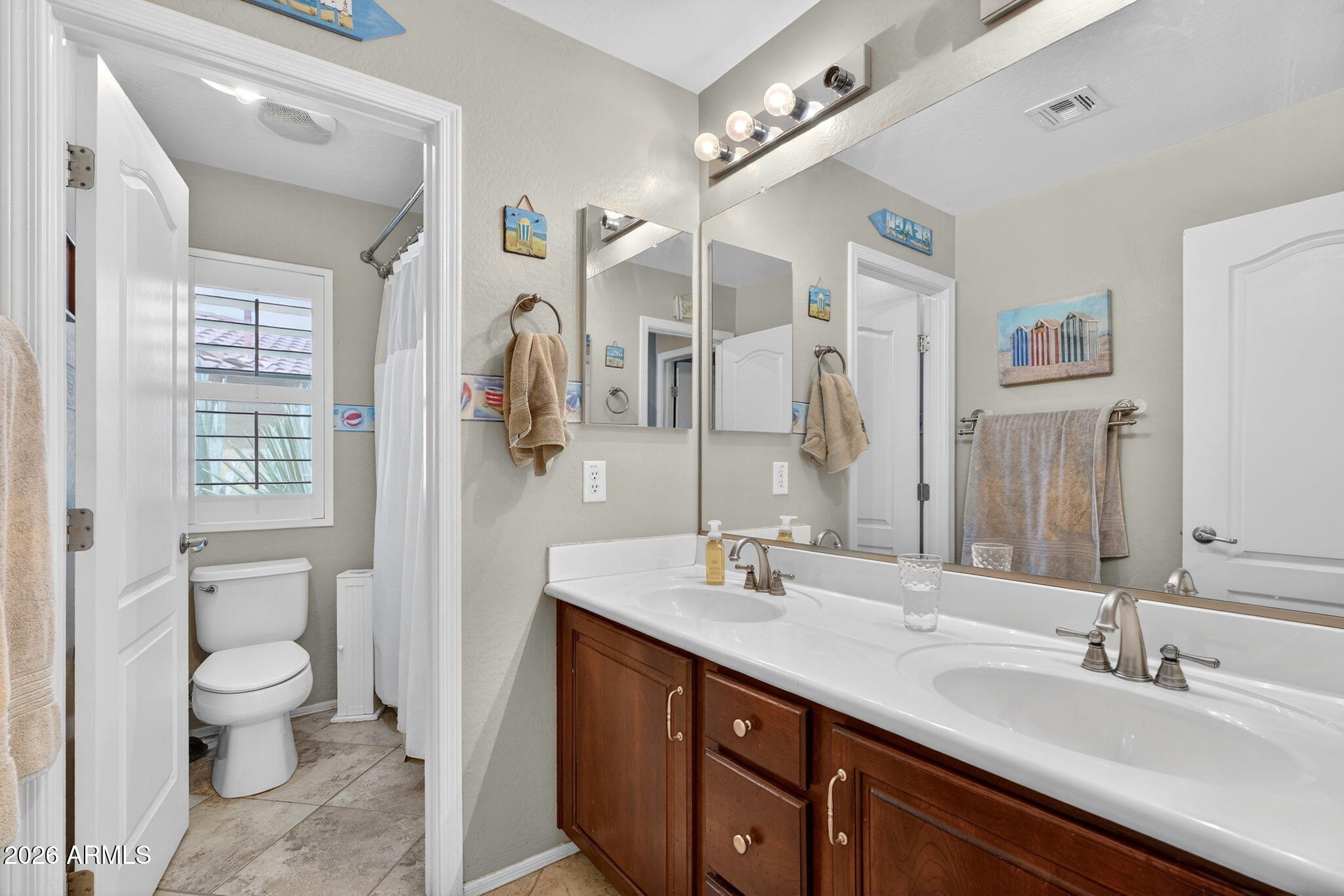 1729 South Reseda Street Gilbert, AZ 85295 - Photo 42 of 52 a spacious bathroom with a double vanity sink a toilet and a mirror