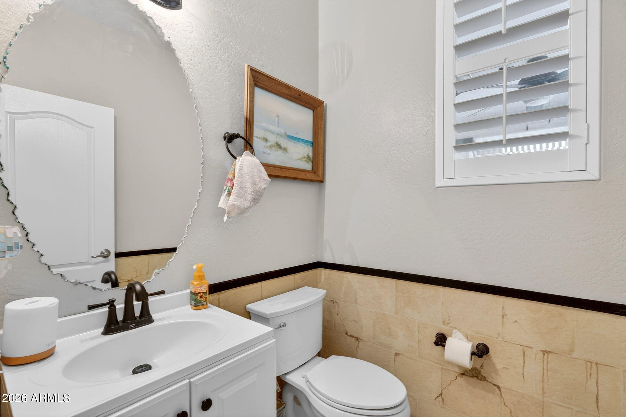 1729 South Reseda Street Gilbert, AZ 85295 - Photo 43 of 52 a bathroom with a sink a toilet and a mirror