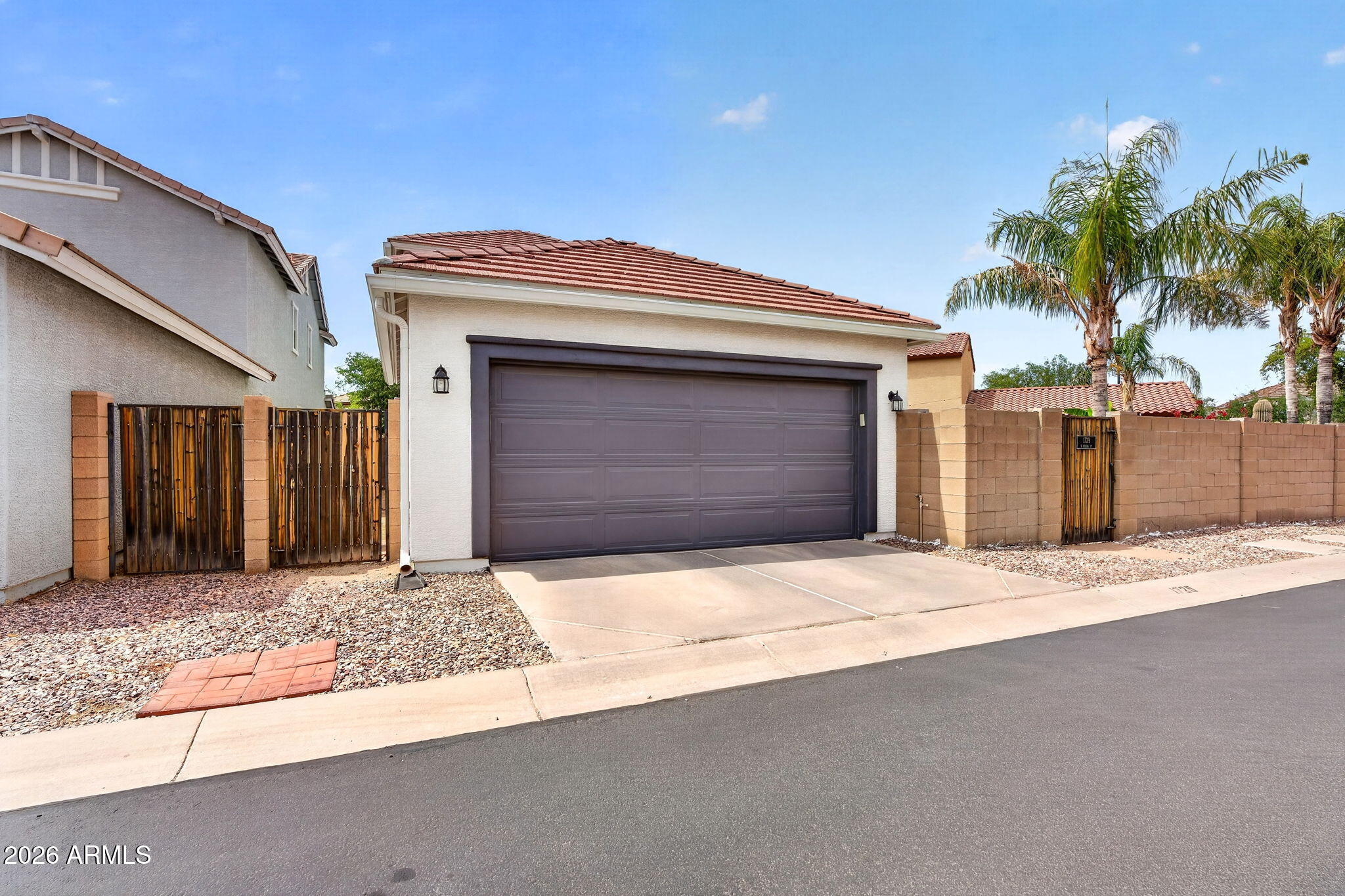 1729 South Reseda Street Gilbert, AZ 85295 - Photo 51 of 52 a front view of a house with a garage