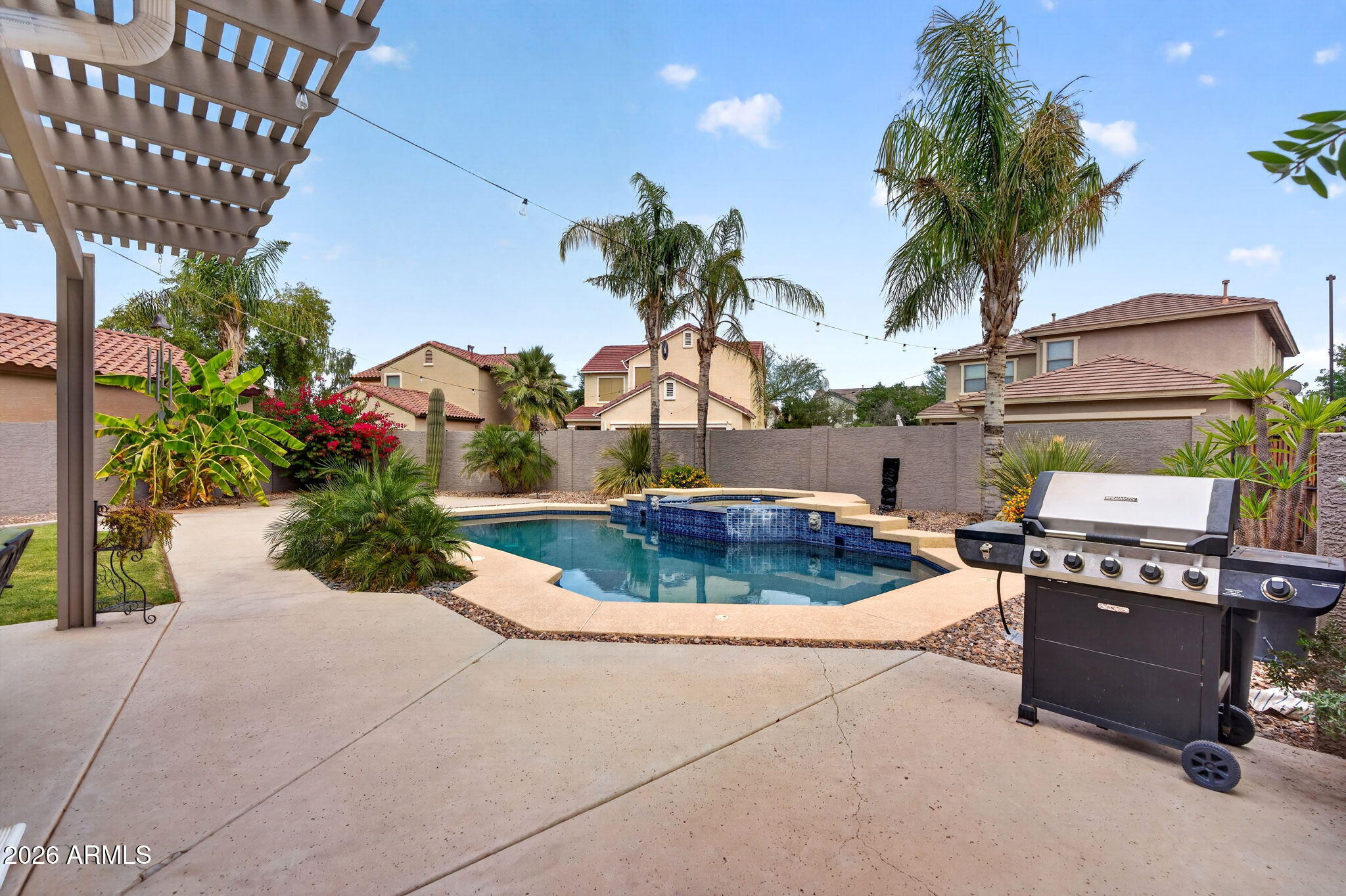 1729 South Reseda Street Gilbert, AZ 85295 - Photo 6 of 52 a view of a backyard with plants and a patio