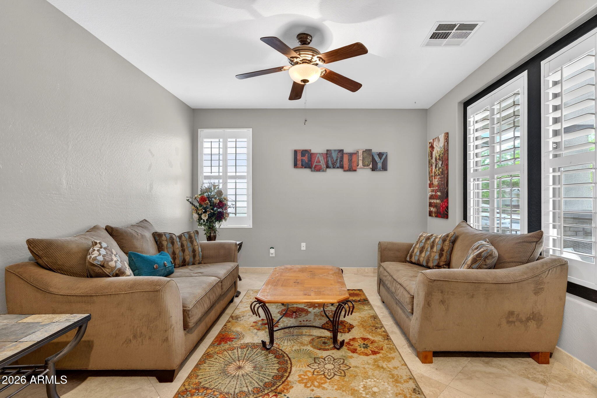 1729 South Reseda Street Gilbert, AZ 85295 - Photo 8 of 52 a living room with furniture and a large window