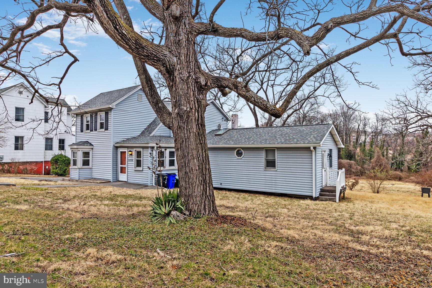 6250 Old Washington Road Elkridge, MD 21075 - Photo 28 of 28 a house that has a tree in front of it