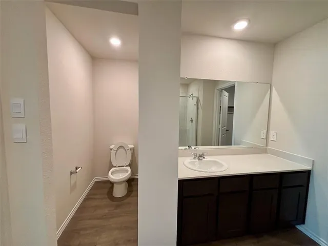 a bathroom with a glass shower door