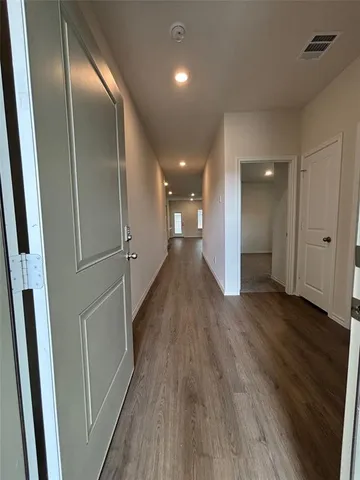 a view of entryway with wooden floor