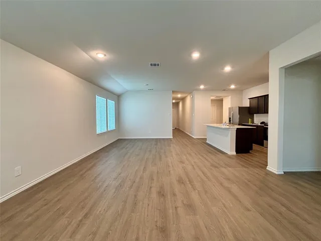 a view of kitchen with wooden floor