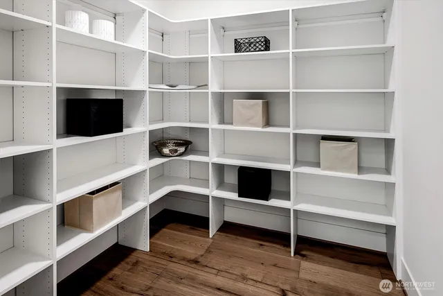 a bedroom with a bed and a mirror