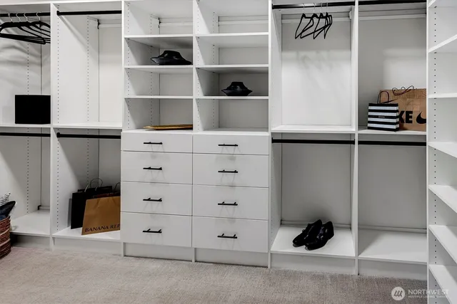 a kitchen with sink and cabinets