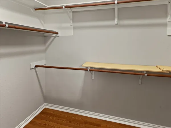 a view of a room with shelf on the wall