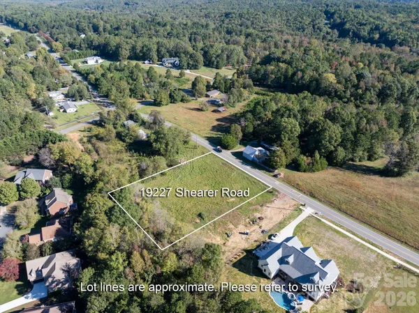 an aerial view of a golf course with parking space