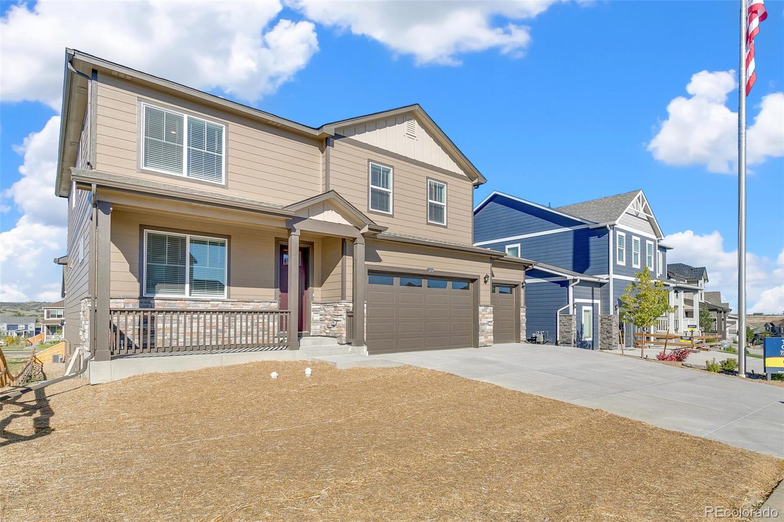 18358 Field Mint Point Parker, CO 80134 - Photo 2 of 34 a front view of a house with a garage