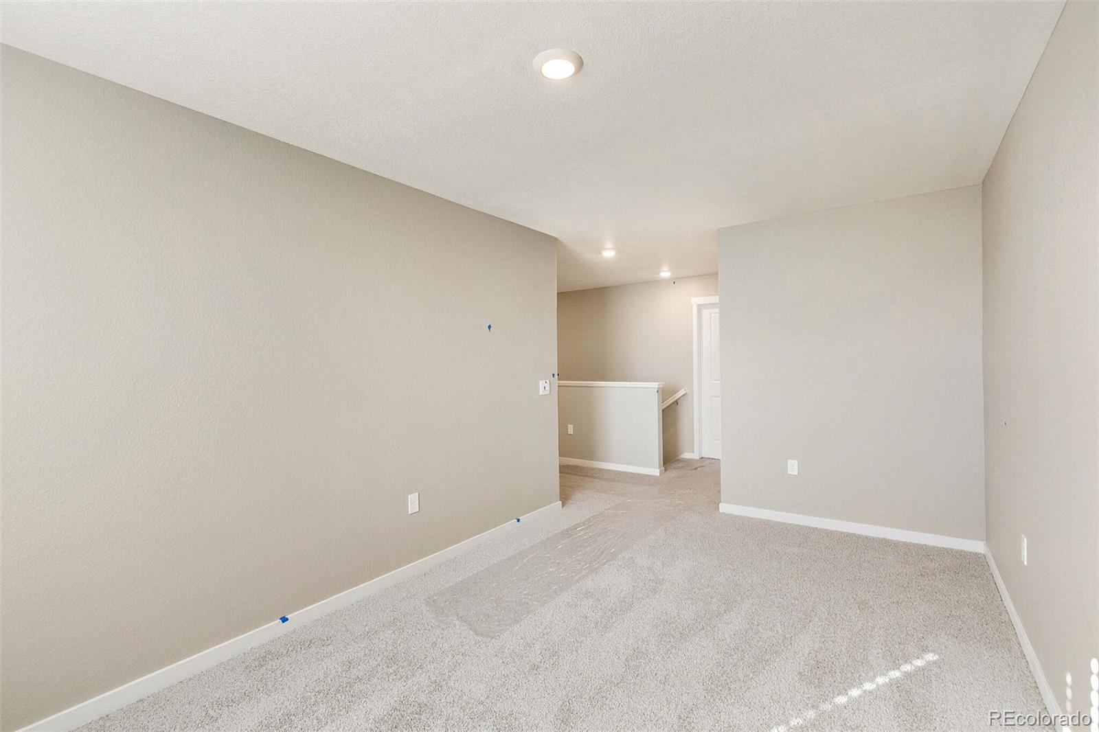 18358 Field Mint Point Parker, CO 80134 - Photo 22 of 34 a view of a room with a hallway