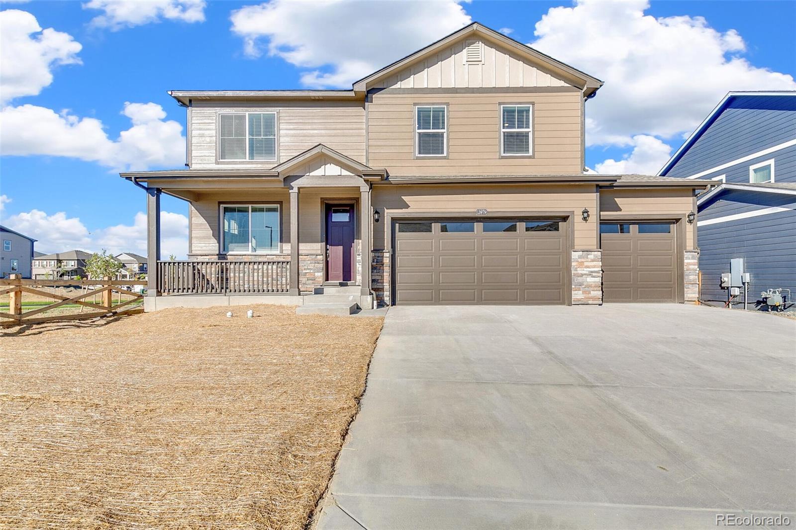 18358 Field Mint Point Parker, CO 80134 - Photo 3 of 34 a view of a white house with a yard and garage