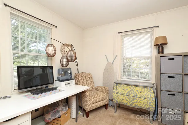 a living room with furniture a window and a fireplace