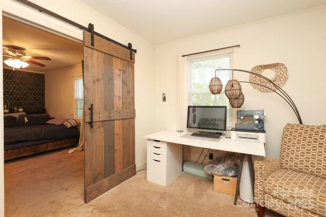 a workspace with furniture and window