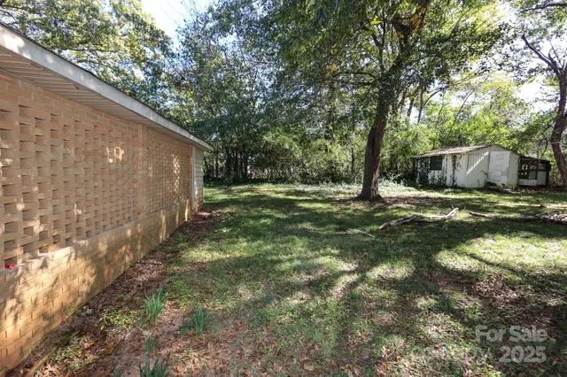 a backyard of a house with lots of green space