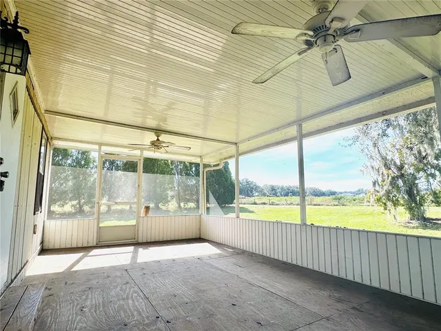 a view of an empty room with a balcony