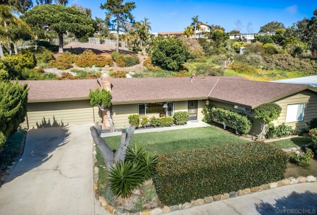 a view of a patio with table and chairs and potted plants