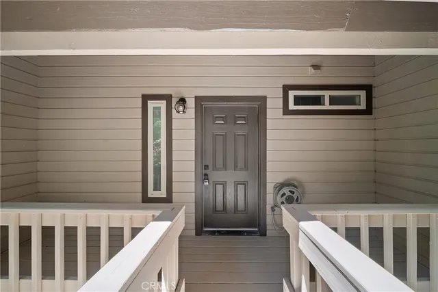 a view of a house with a small deck