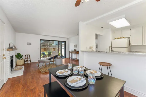 a view of a dining room with furniture window and wooden floor