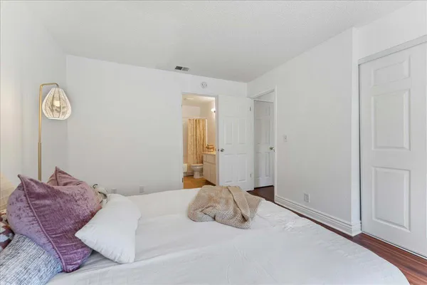 a bedroom with a bed and a closet