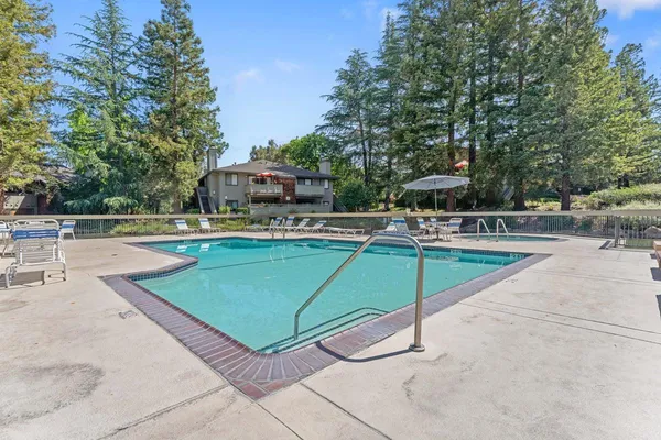 a swimming pool with outdoor seating and outdoor space