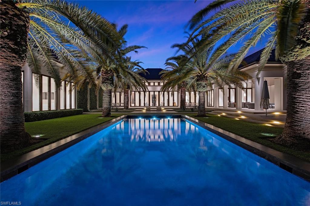 3655 Fort Charles Drive Naples, FL 34102 - Photo 1 of 50 a view of swimming pool with a patio
