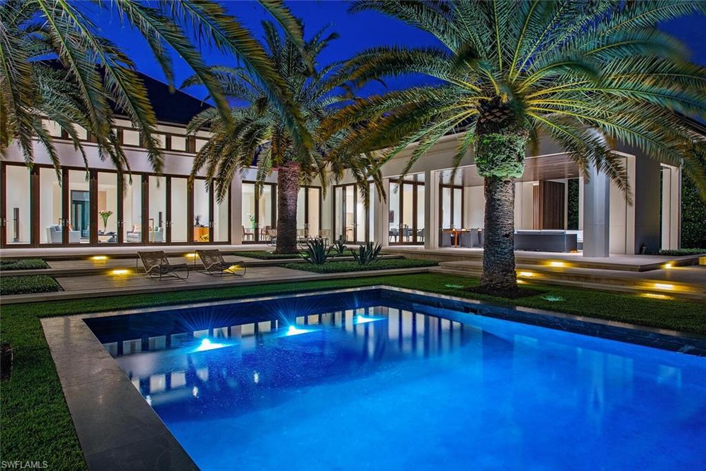 3655 Fort Charles Drive Naples, FL 34102 - Photo 2 of 50 a house view with a garden space