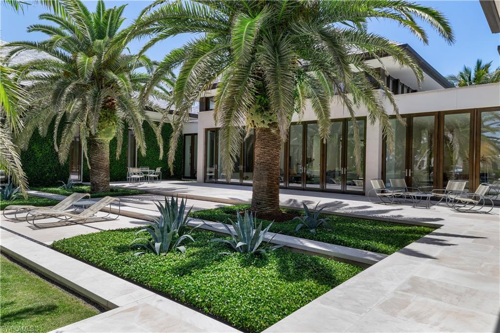 3655 Fort Charles Drive Naples, FL 34102 - Photo 32 of 50 a view of a park with palm trees