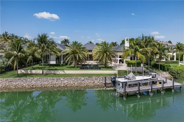 an aerial view of a house with a ocean view