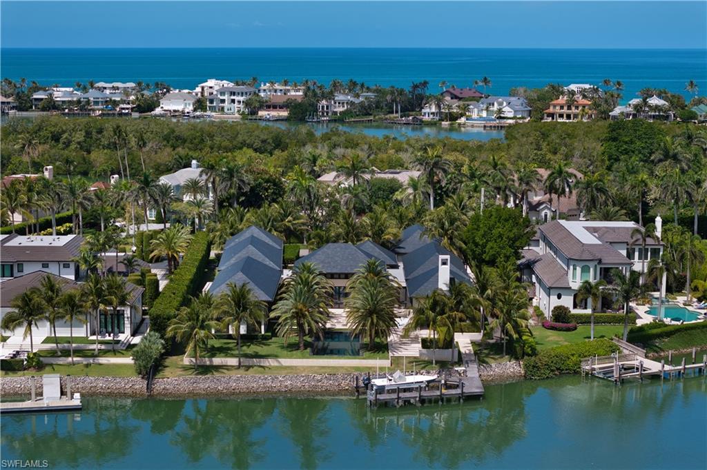 3655 Fort Charles Drive Naples, FL 34102 - Photo 45 of 50 an aerial view of residential houses with outdoor space