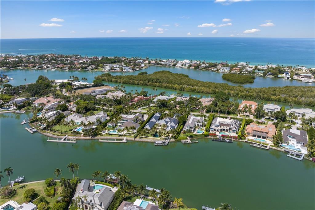 3655 Fort Charles Drive Naples, FL 34102 - Photo 46 of 50 an aerial view of a house with a ocean view