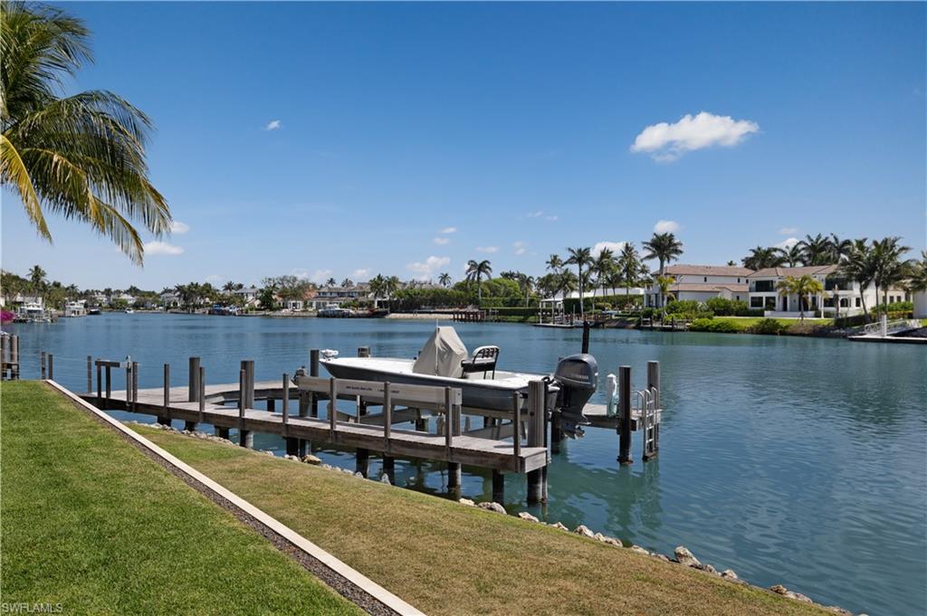 3655 Fort Charles Drive Naples, FL 34102 - Photo 48 of 50 a view of a lake with a terrace