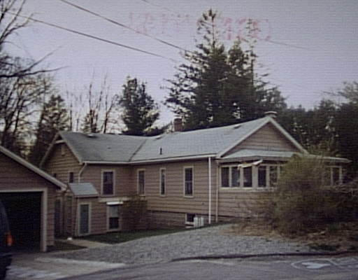 150 Evans Rd Extension Marblehead, MA 01945 - Photo 1 of 1 a front view of a house with a garden