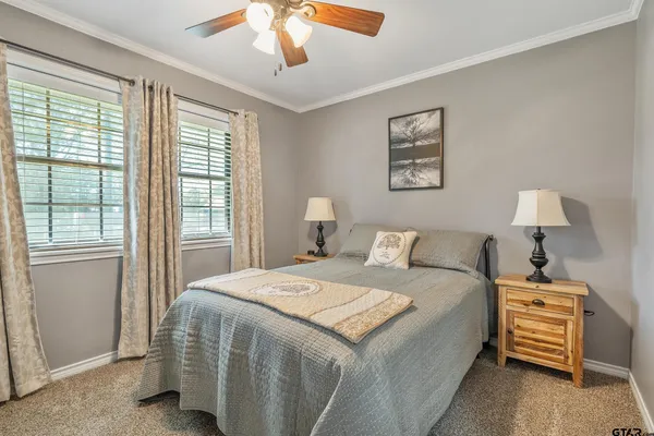 a bedroom with a bed and a lamp