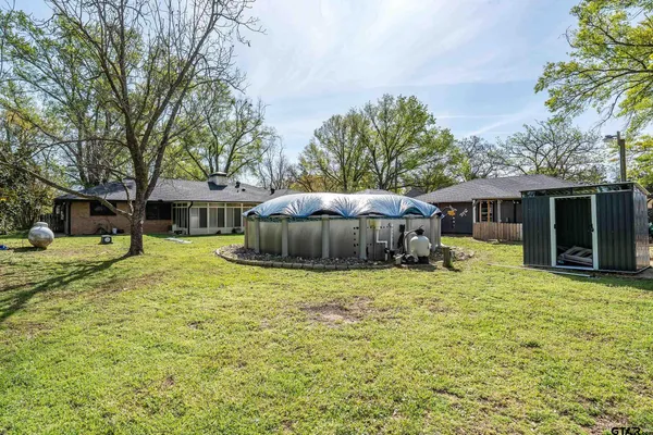 a house with trees in the background